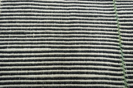 Backside of handmade New Modern Design rug showing knot structure and weave density