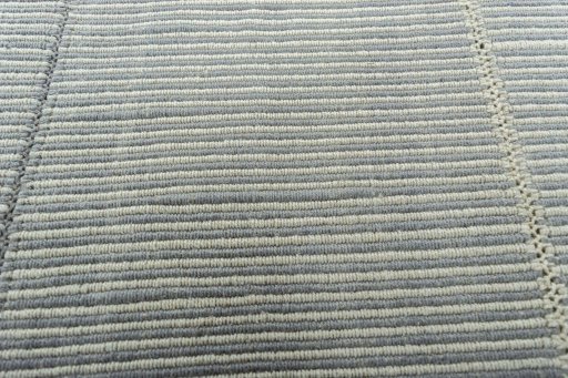 Backside of handmade New Modern Design rug showing knot structure and weave density