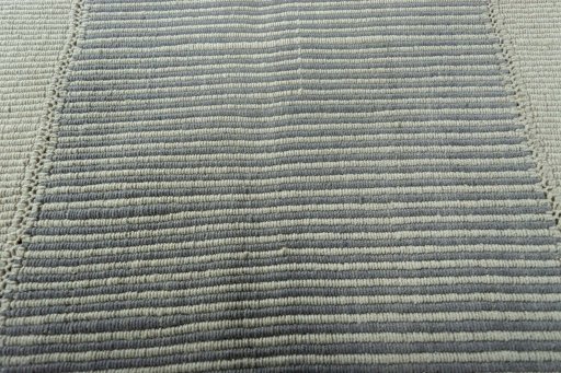 Backside of handmade New Modern Design rug showing knot structure and weave density