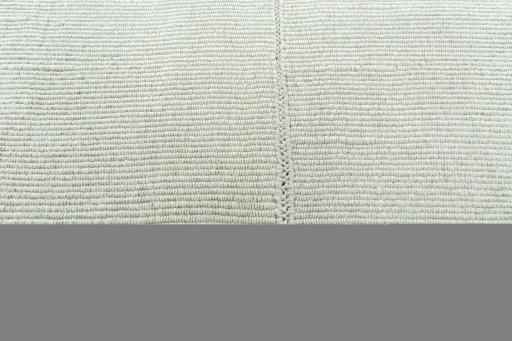 Backside of handmade New Modern Design rug showing knot structure and weave density