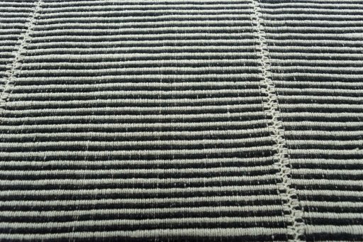Backside of handmade New Modern Design rug showing knot structure and weave density