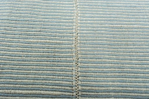 Backside of handmade New Modern Design rug showing knot structure and weave density