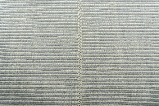 Backside of handmade New Modern Design rug showing knot structure and weave density