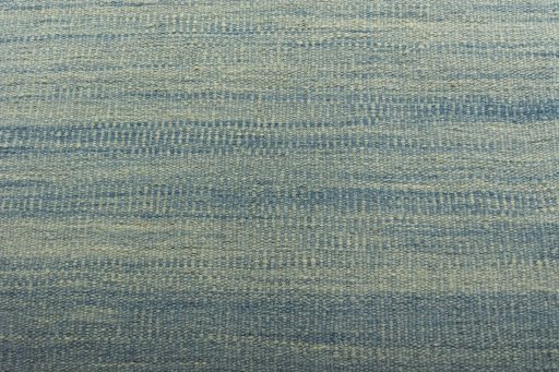 Backside of handmade New Modern Design rug showing knot structure and weave density
