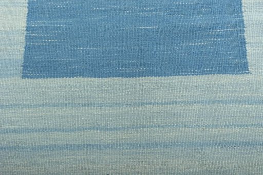 Backside of handmade New Modern Design rug showing knot structure and weave density