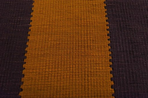 Backside of handmade New Modern Design rug showing knot structure and weave density