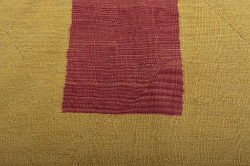 Backside of handmade New Modern Design rug showing knot structure and weave density