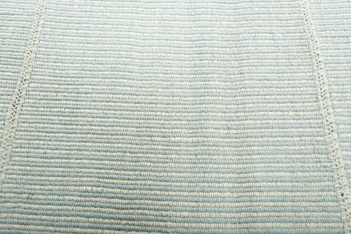Backside of handmade New Modern Design rug showing knot structure and weave density
