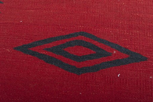 Backside of handmade New Modern Design rug showing knot structure and weave density