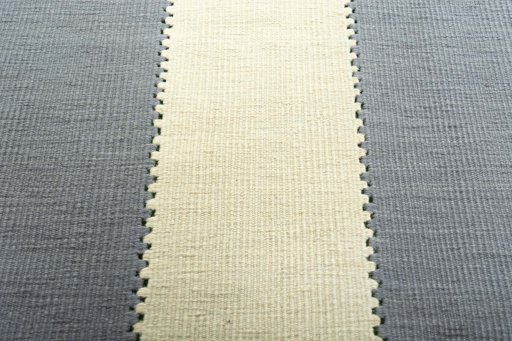 Backside of handmade New Modern Design rug showing knot structure and weave density