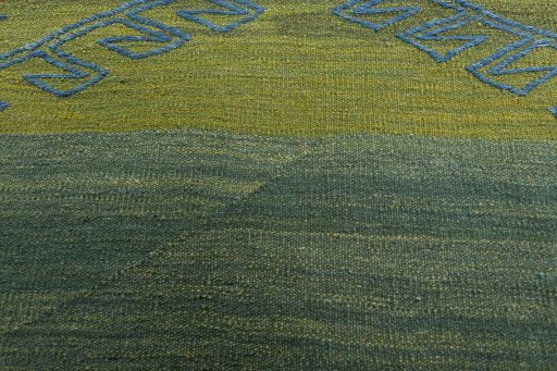 Backside of handmade New Modern Design rug showing knot structure and weave density