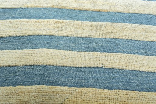 Backside of handmade New Modern Design rug showing knot structure and weave density