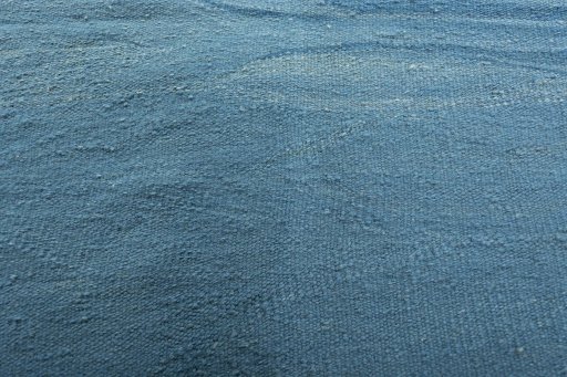 Backside of handmade New Modern Design rug showing knot structure and weave density