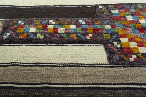 Backside of handmade New Modern Design rug showing knot structure and weave density