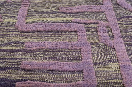 Backside of handmade New Modern Design rug showing knot structure and weave density