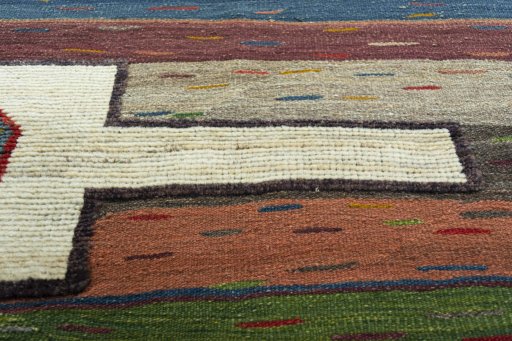 Backside of handmade New Modern Design rug showing knot structure and weave density
