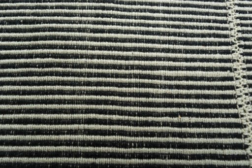 Backside of handmade New Modern Design rug showing knot structure and weave density