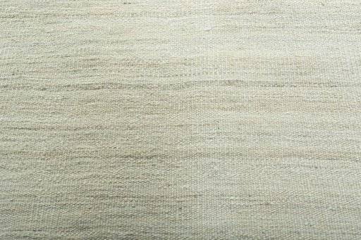 Backside of handmade New Modern Design rug showing knot structure and weave density