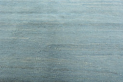 Backside of handmade New Modern Design rug showing knot structure and weave density