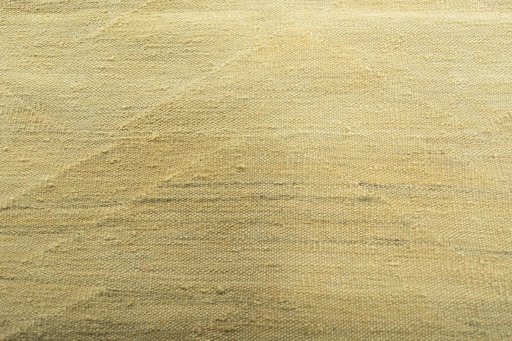 Backside of handmade New Modern Design rug showing knot structure and weave density