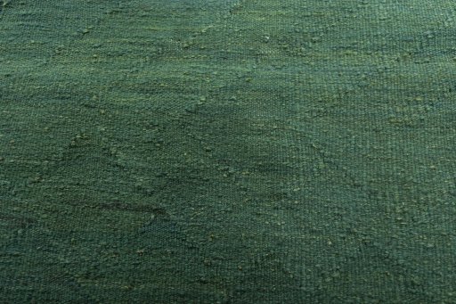 Backside of handmade New Modern Design rug showing knot structure and weave density