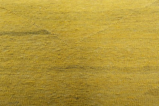 Backside of handmade New Modern Design rug showing knot structure and weave density