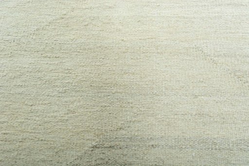 Backside of handmade New Modern Design rug showing knot structure and weave density