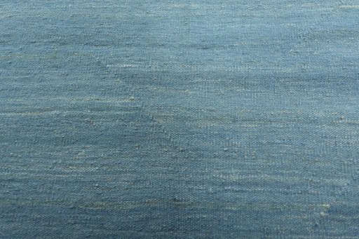 Backside of handmade New Modern Design rug showing knot structure and weave density