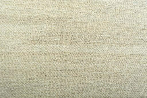 Backside of handmade New Modern Design rug showing knot structure and weave density