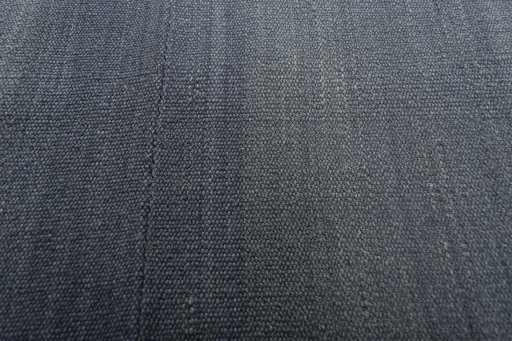 Backside of handmade New Modern Design rug showing knot structure and weave density