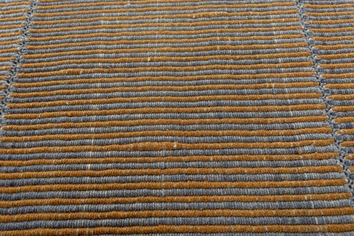 Backside of handmade New Modern Design rug showing knot structure and weave density