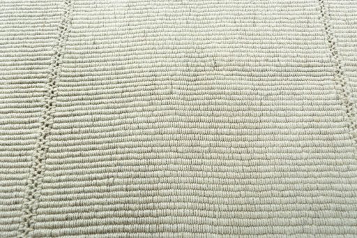 Backside of handmade New Modern Design rug showing knot structure and weave density