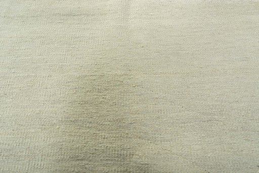 Backside of handmade New Modern Design rug showing knot structure and weave density