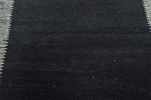 Backside of handmade New Modern Design rug showing knot structure and weave density