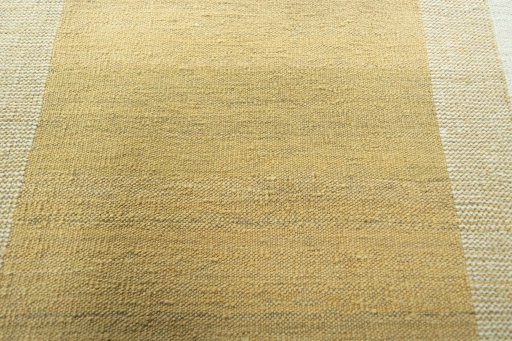 Backside of handmade New Modern Design rug showing knot structure and weave density