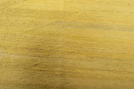 Backside of handmade New Modern Design rug showing knot structure and weave density