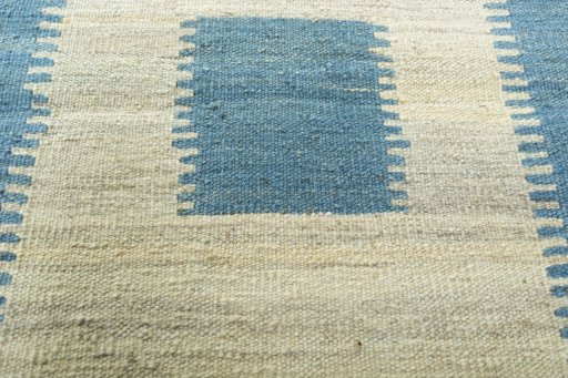 Backside of handmade New Modern Design rug showing knot structure and weave density
