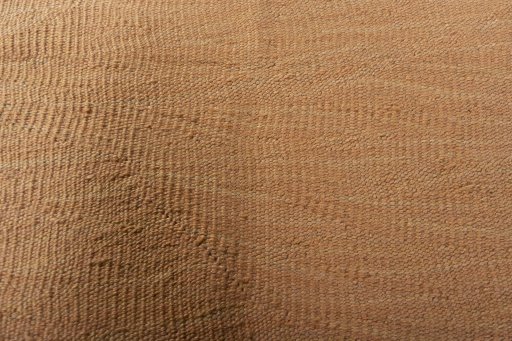 Backside of handmade New Modern Design rug showing knot structure and weave density
