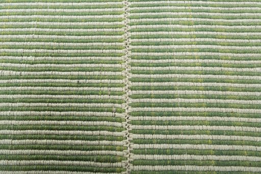 Backside of handmade New Modern Design rug showing knot structure and weave density