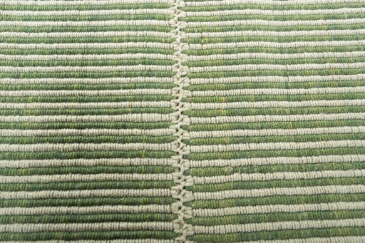 Backside of handmade New Modern Design rug showing knot structure and weave density