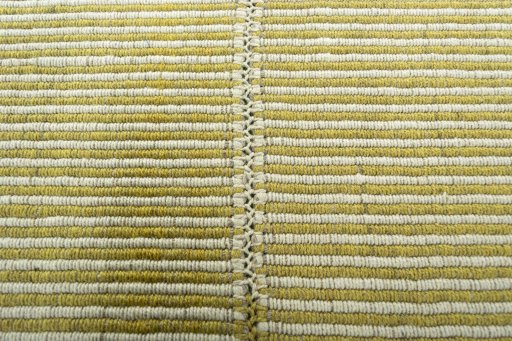 Backside of handmade New Modern Design rug showing knot structure and weave density