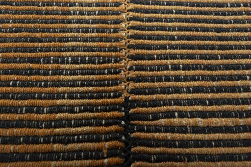 Backside of handmade New Modern Design rug showing knot structure and weave density