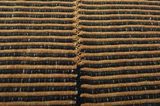 Backside of handmade New Modern Design rug showing knot structure and weave density