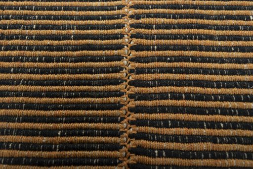 Backside of handmade New Modern Design rug showing knot structure and weave density