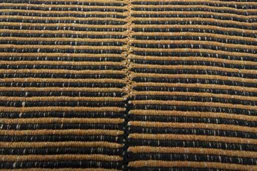 Backside of handmade New Modern Design rug showing knot structure and weave density