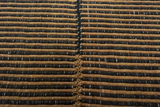 Backside of handmade New Modern Design rug showing knot structure and weave density