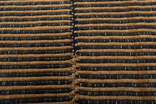 Backside of handmade New Modern Design rug showing knot structure and weave density