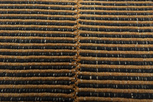 Backside of handmade New Modern Design rug showing knot structure and weave density