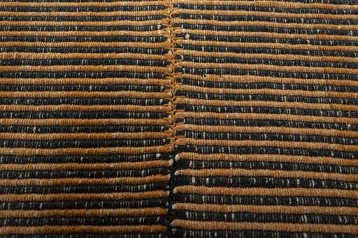 Backside of handmade New Modern Design rug showing knot structure and weave density