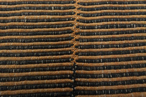 Backside of handmade New Modern Design rug showing knot structure and weave density